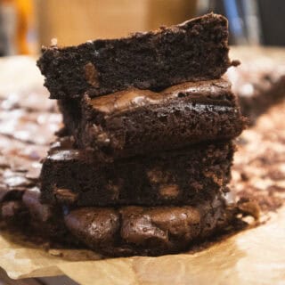 Close-up of a sliced chocolate chip brownie with gooey center and rich texture
