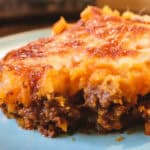 A golden sweet potato cottage pie with a rich beef filling, topped with creamy mashed sweet potato and baked until lightly crisp.